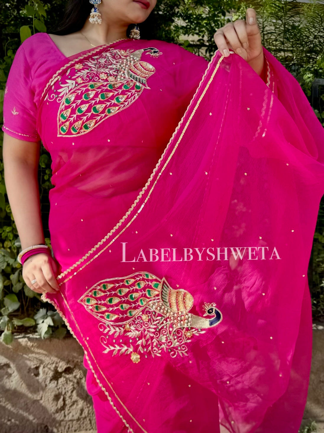 Rani pink Single Diamond chiffon saree with Peacock Motifs and Statement Shoulder Embroidery