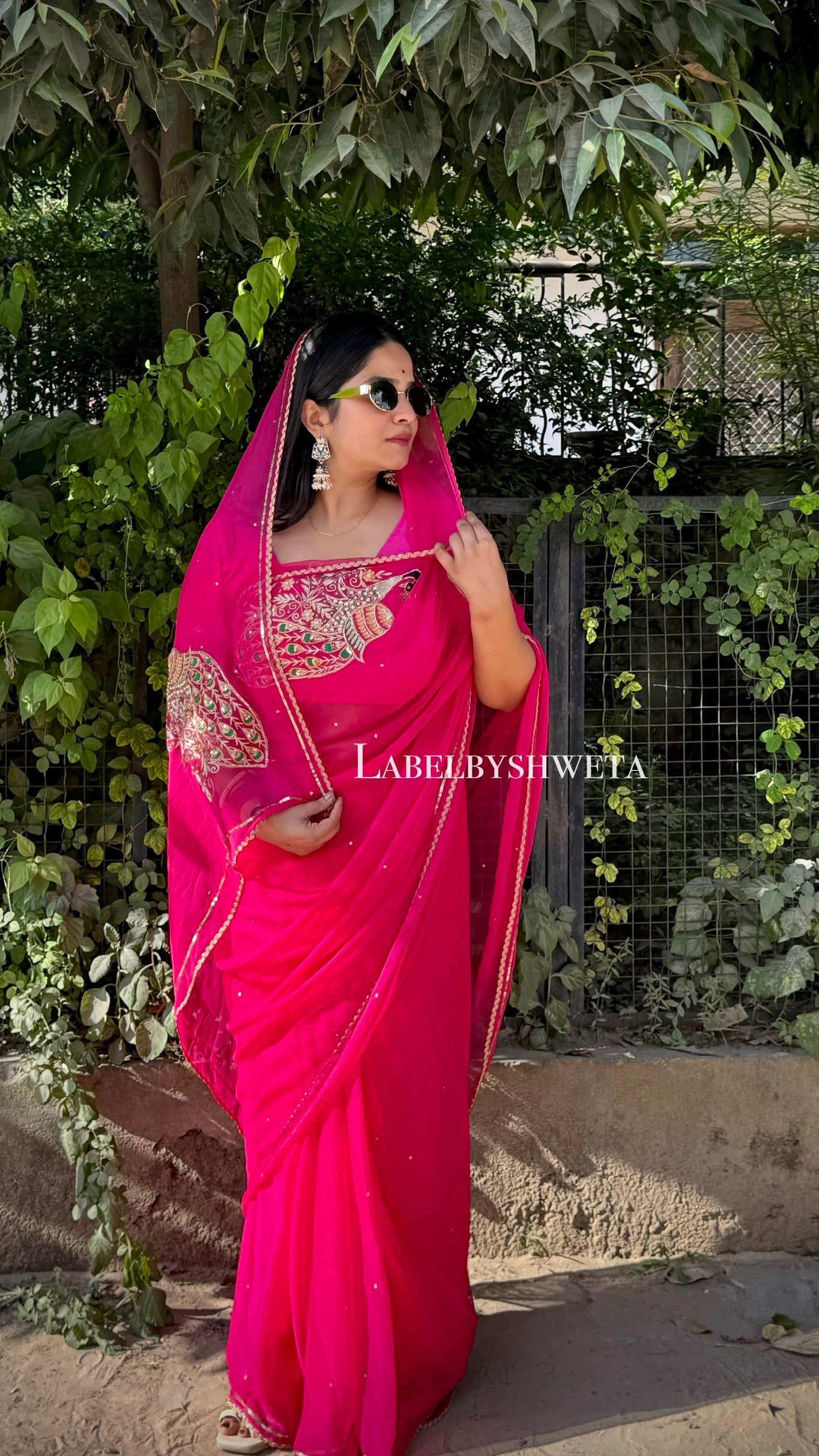 Rani pink Single Diamond chiffon saree with Peacock Motifs and Statement Shoulder Embroidery
